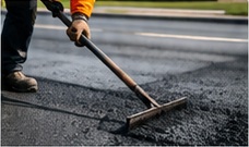 Asphalt surface being smoothed